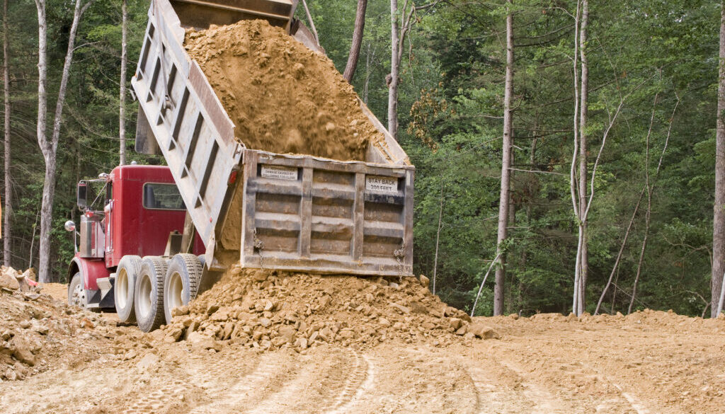 Start a dump truck business - Dump Truck Unloading Dirt