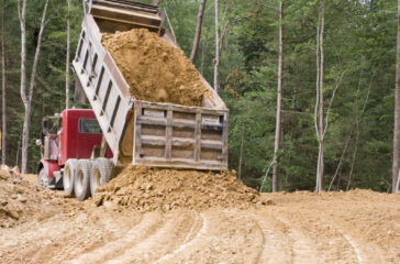 Start a dump truck business - Dump Truck Unloading Dirt