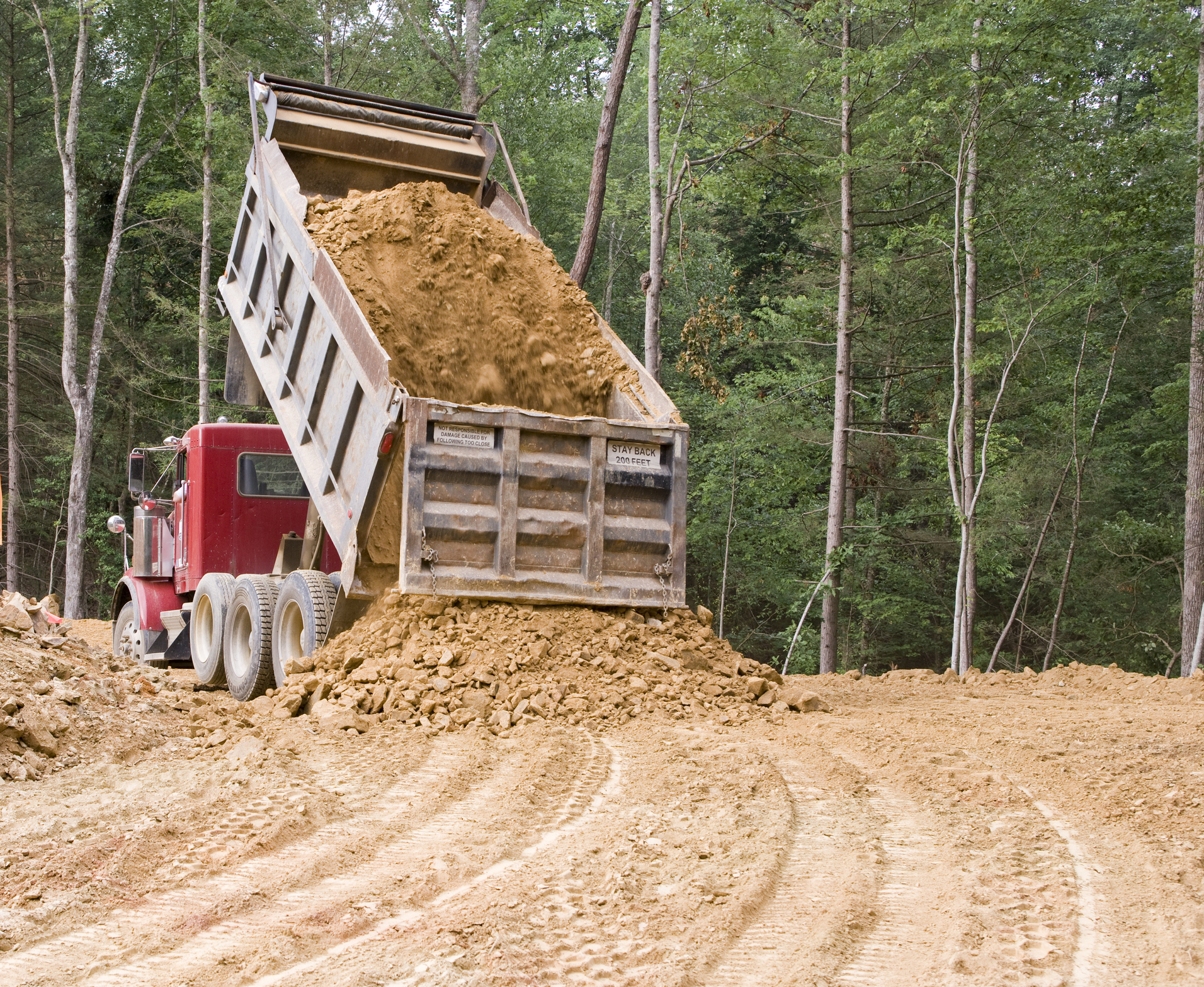 Start a Dump Truck Business - Red dump truck on road