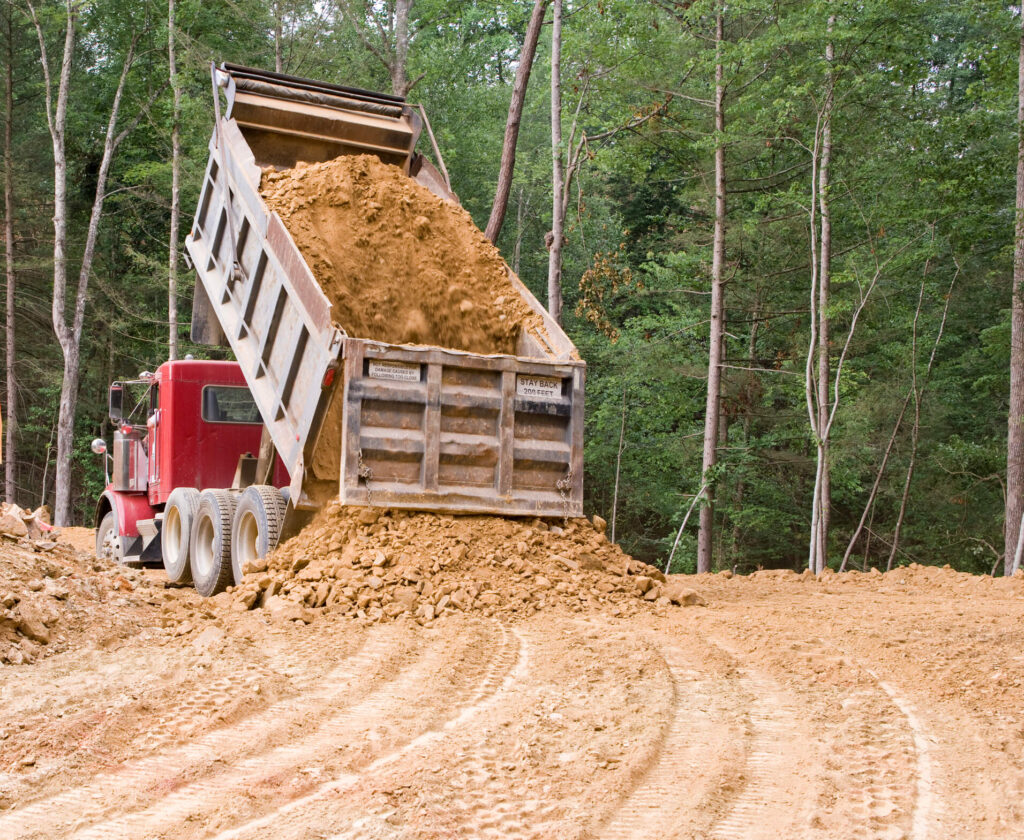 Comprehensive Dump Truck Driver Glossary - Dump Truck Unloading Dirt