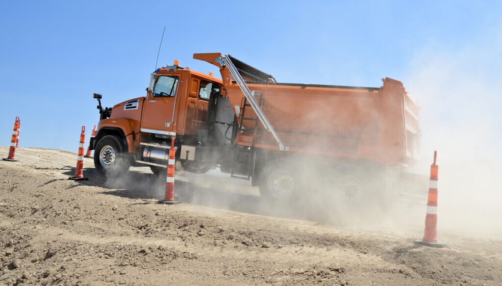 U.S. Dump Truck Directory-Orange dump truck at job site
