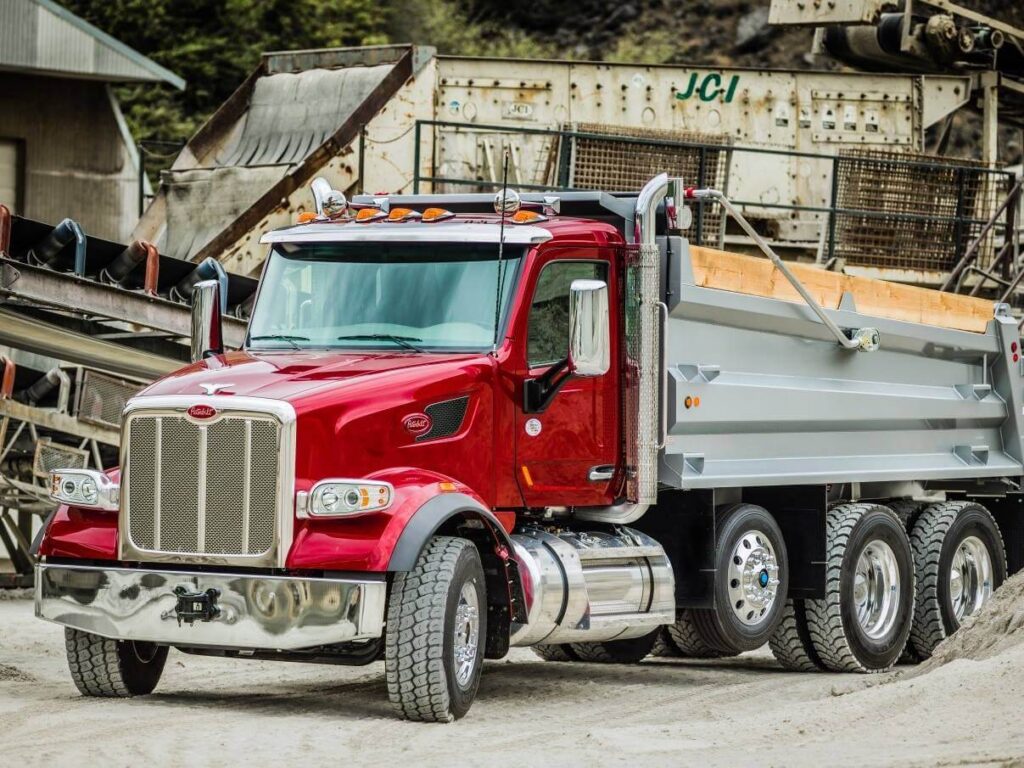 DumpTruckN - Working to become the #1 resource for dump truck owners - red dump truck at quarry