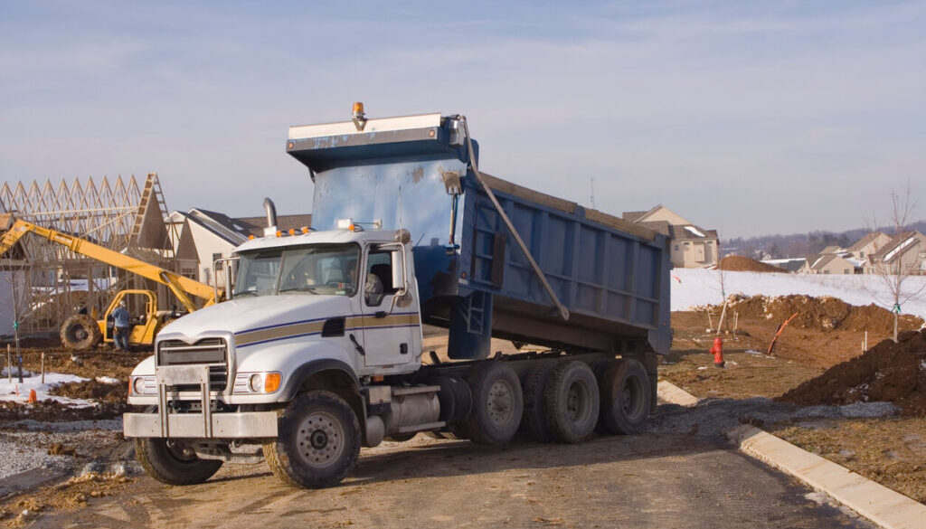 Subcontracting dump truck work - Dump Truck at Construction Site