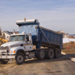 Subcontracting dump truck work - Dump Truck at Construction Site