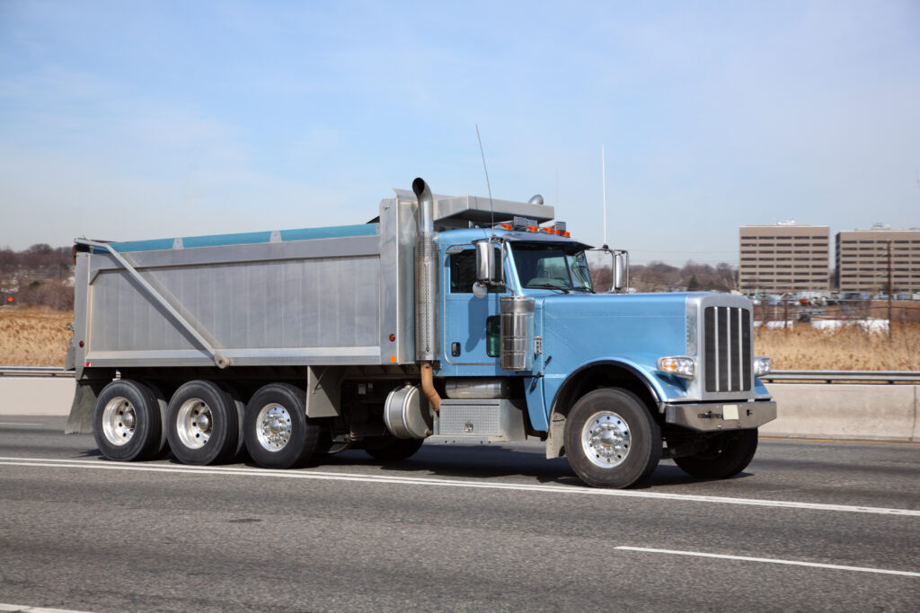 Blue Dump Truck on the highway