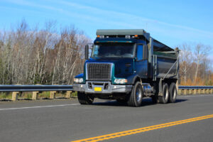 Dump Truck Association blue dump truck Blue dump truck on a road
