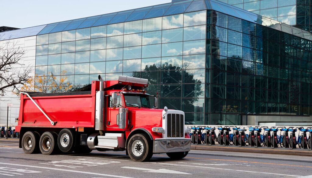 How to sell a dump truck, red Infront of bikes