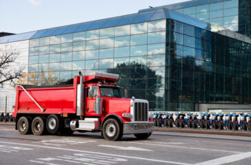 How to sell a dump truck, red Infront of bikes